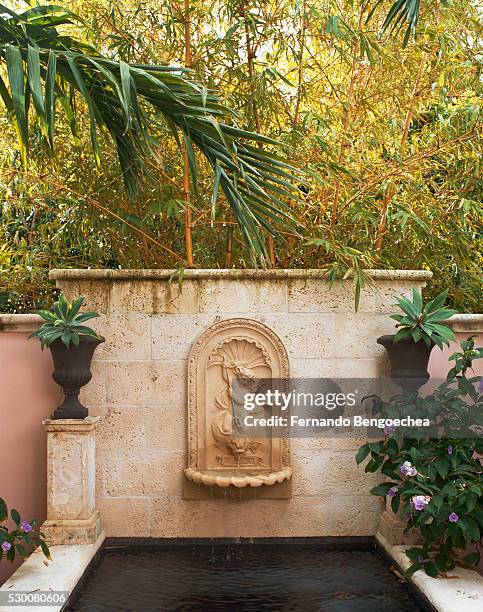 wall fountain and pool on patio - bamboo water fountain stock pictures, royalty-free photos & images