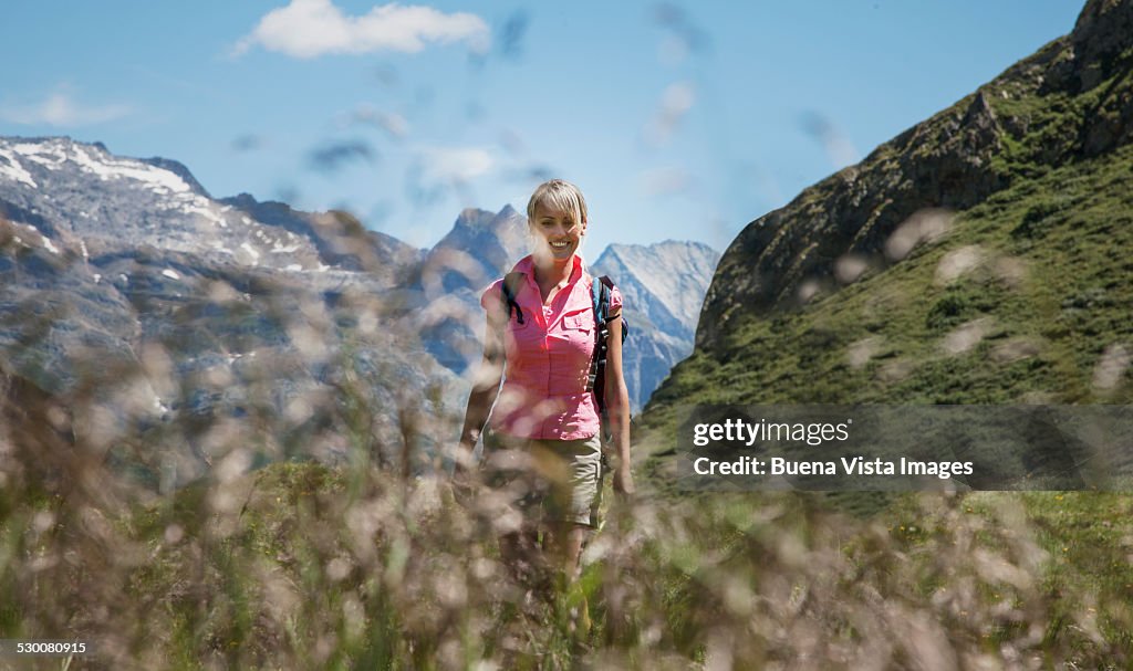 Woman hiking in a mountain valley