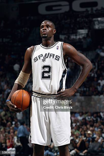 Nazr Mohammed of the San Antonio Spurs shoots a free throw during Game five of the Western Conference Semifinals with the Seattle SuperSonics during...