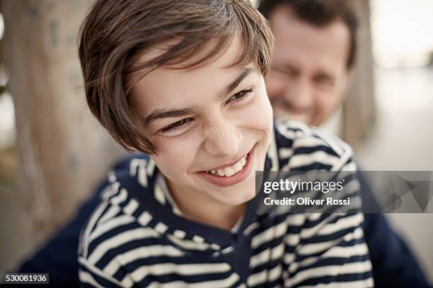 happy boy with father outdoors - 14歳から15歳 ストックフォトと画像