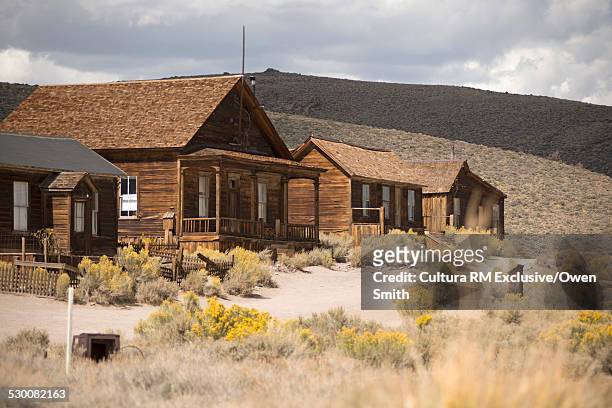 row of abandoned old houses in bodie ghost town, bodie national park, california, usa - ghost town stock pictures, royalty-free photos & images
