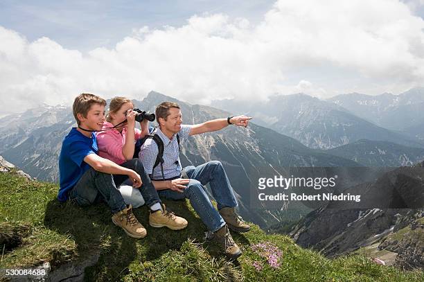 father and kids enjoying mountains view - hiking across the karwendel mountain range stock pictures, royalty-free photos & images