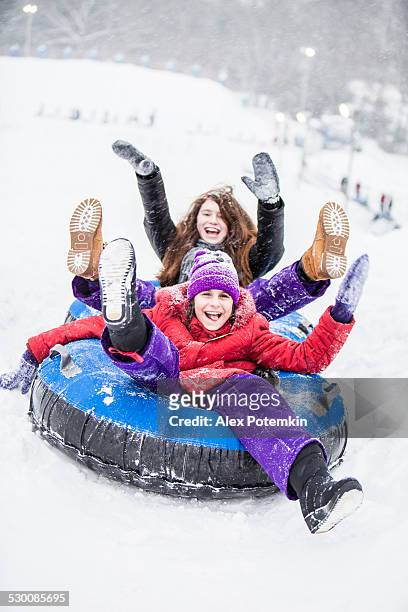 snowtubing - tube girl fotografías e imágenes de stock