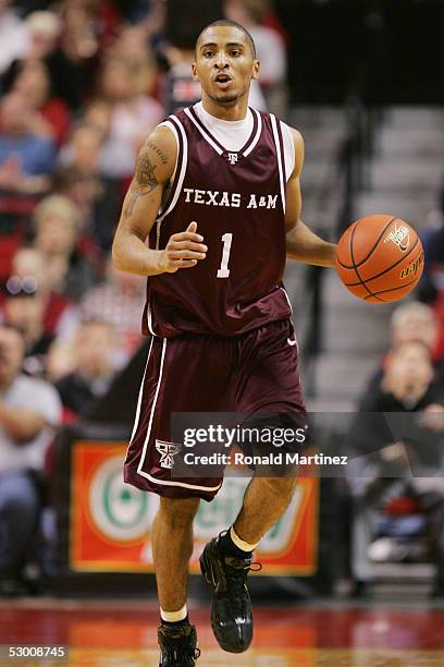 Acie Law#1 of the Texas A&M Aggies moves the ball against the Texas Tech Red Raiders on January 15, 2005 at the United Spirit Arena in Lubbock,...