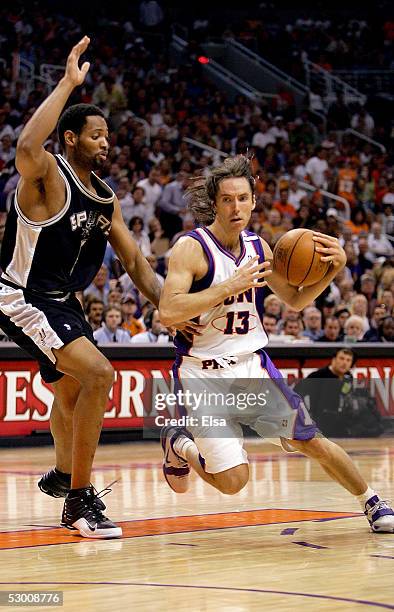 Steve Nash of the Phoenix Suns drives around Robert Horry of the San Antonio Spurs in Game five of the Western Conference Finals during the 2005 NBA...