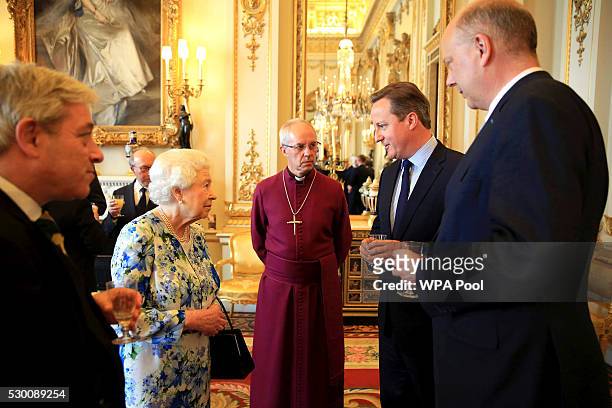 Queen Elizabeth II speaks with Prime Minister David Cameron , as Chris Grayling , leader of the House of Commons and Archbishop of Canterbury Justin...