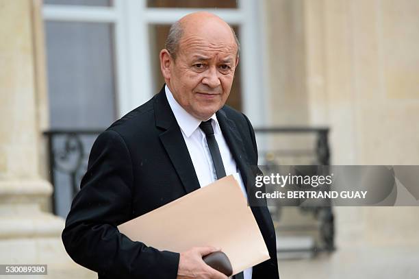 French Defense minister Jean-Yves Le Drian leaves after an extraordinary cabinet meeting, on May 10, 2016 at the Elysee palace in Paris. The meeting...