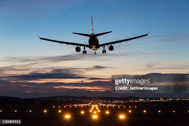 landing airplane - airplane flying stock pictures, royalty-free photos & images