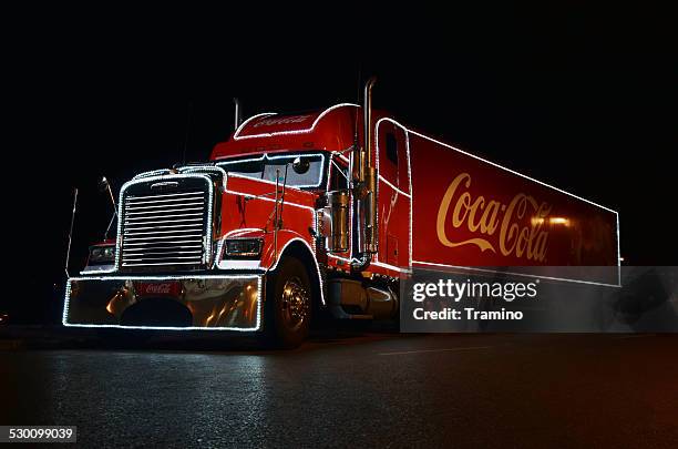 coca-cola christmas truck at night - company christmas at pops stock pictures, royalty-free photos & images