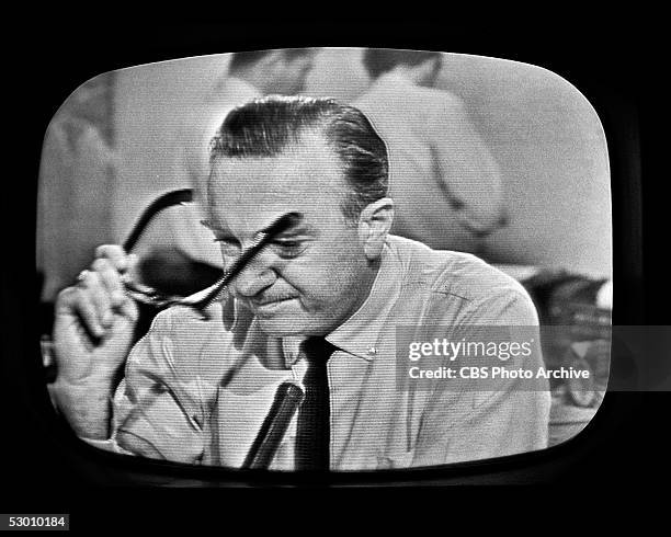 Television frame grab of American broadcast journalist and anchorman Walter Cronkite as he removes his glasses and prepares to announce the death of...