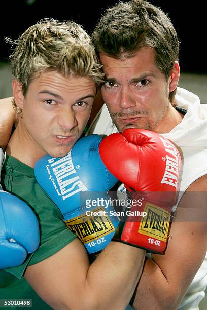 Actors Pete Dwojak and Daniel Fehlow pose at a photocall on the set of the German television series "Gute Zeiten, Schlechte Zeiten" on June 2, 2005...