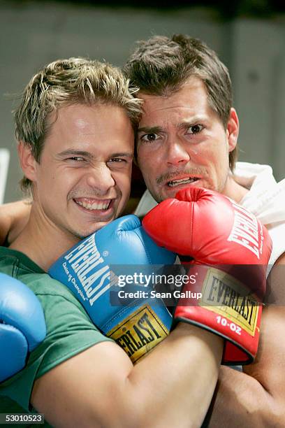 Actors Pete Dwojak and Daniel Fehlow pose at a photocall on the set of the German television series "Gute Zeiten, Schlechte Zeiten" on June 2, 2005...