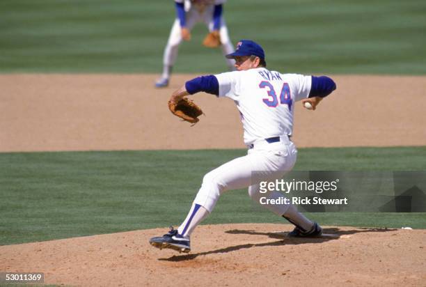 Nolan Ryan of the Texas Rangers pitches during the 1990 season at Arlington Stadium in Arlington, Texas.