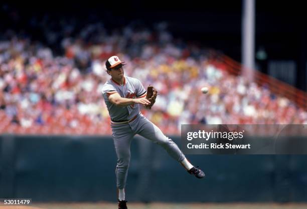 Cal Ripken Jr. #8 of the Baltimore Orioles throws the ball during a game in the 1986 season against the California Angels at Anaheim Stadium in...