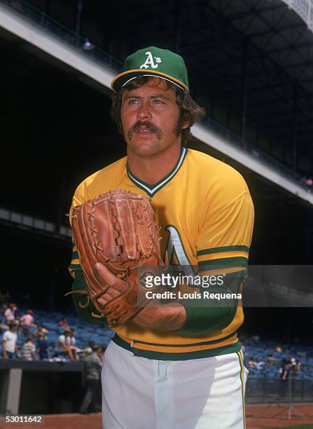 Catfish Hunter of the Oakland Athletics poses for a action portrait circa 1968-1974.