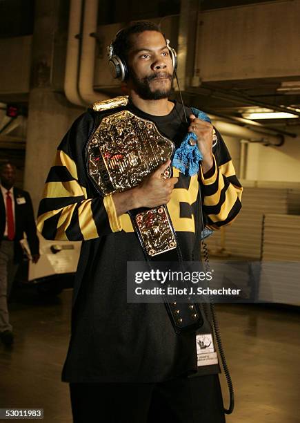 Rasheed Wallace of the Detroit Pistons arrives at the arean wearing a Franco Harris Pittsburgh Steelers throwback jersey and carrying his...