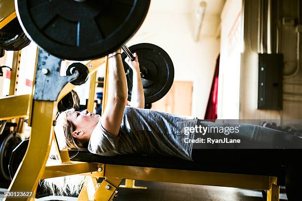 bench press young woman - workout bench stock pictures, royalty-free photos & images