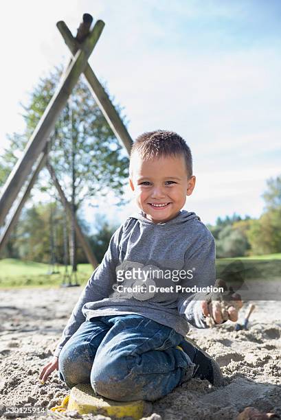 portrait smiling small boy sandbox playground - 2 boys 1 sandbox stock pictures, royalty-free photos & images