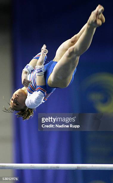Emile Lepennec of France performs on the bars during the women's qualification competition of the Gymnastics European Championships on June 2, 2005...