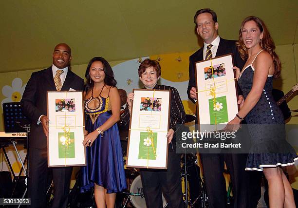 Tiki Barber and wife Ginny, Maxine Clark and Tod Waterman and Allison Waterman except an award at the Fresh Air Funds Annual Spring Gala to Salute...