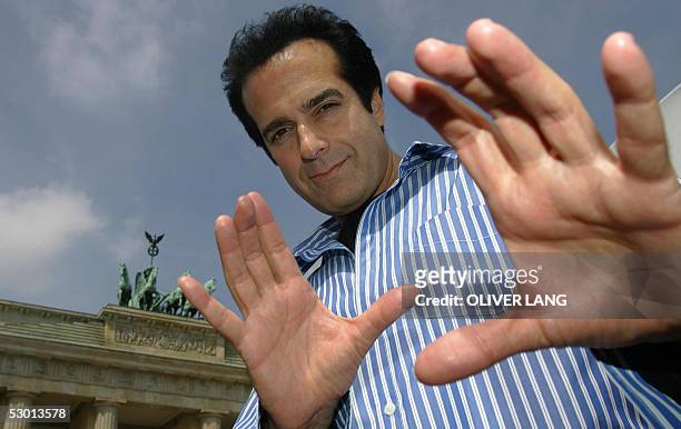 Magician David Copperfield poses in front of Berlin's landmark Brandenburg Gate 03 June 2005. He came to the German capital to promote his new show...