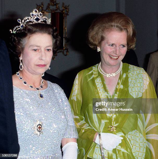 Queen Elizabeth II and Prime Minister Margaret Thatcher attend a ball to celebrate the Commonwealth Heads of Government Meeting hosted by President...