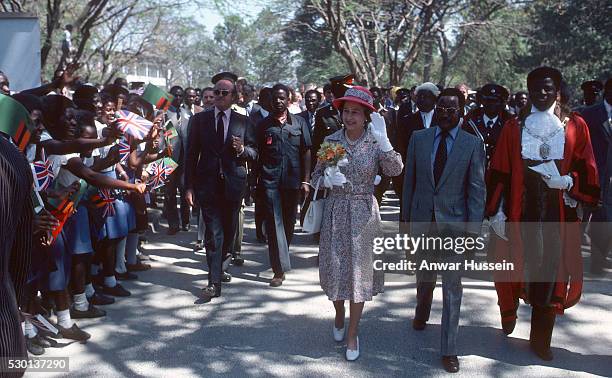 Queen Elizabeth ll is greeted by the public as she arrives in Lusaka on July 31,1979 in Lusaka, Zambia.