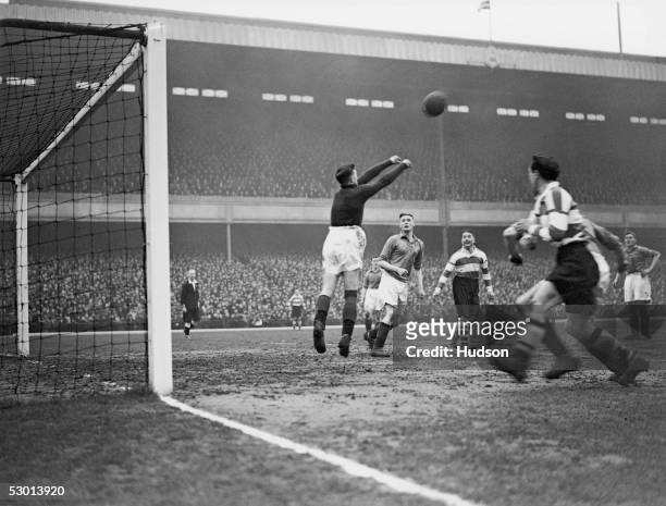 Arsenal's Alex James watches Ellis, the Barnsley keeper during an FA Cup quarter final tie at Highbury, London, 29th February 1936. Arsenal...