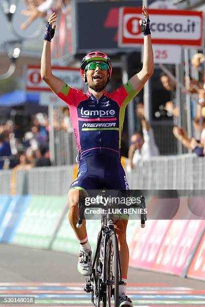 Italian cyclist Diego Ulissi of Lampre - Merida celebrates as he crosses the finish line at the end of the fourth stage during the 99th Giro...