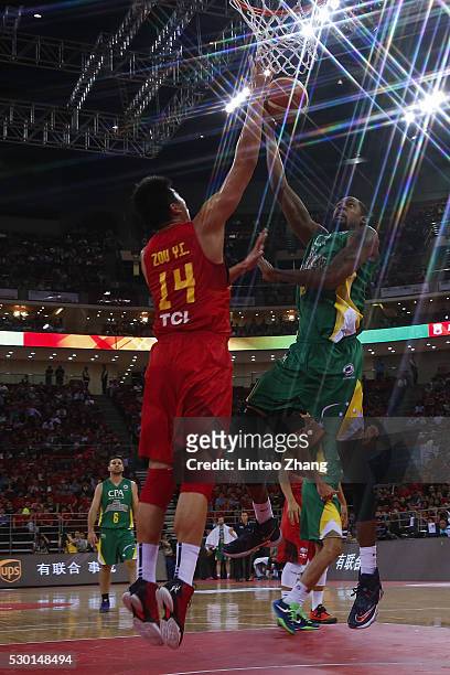 Mickell Gladness of Australia drives to the basket against Zou Yuchen of China during Internationl Basketball Challenge match between the Chinese...