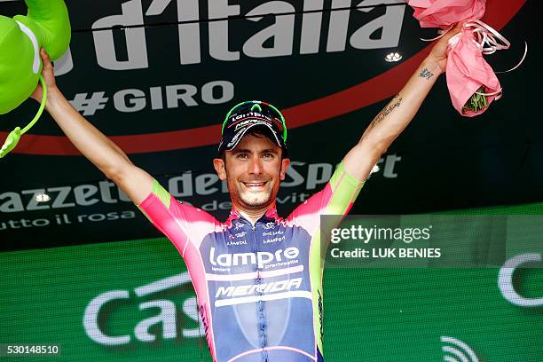 Italian cyclist Diego Ulissi of Lampre - Merida celebrates on the podium after winning the fourth stage of 200 km from Catanzaro to Praia a Mare...
