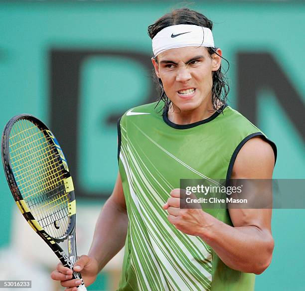 Rafael Nadal of Spain celebrates winning a point during his semi-final match against Roger Federer of Switzerland during the twelfth day of the...