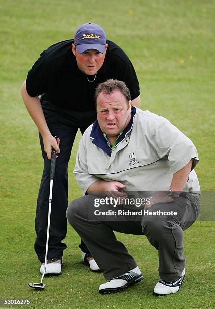 John Gallagher of Scotland lines up a putt on the 18th green with his caddie Jim Finnley during his semi final match with Lloyd Saltman of Scotland...