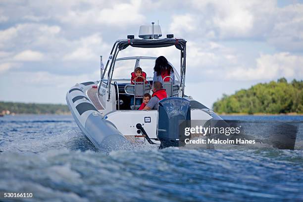 family in motorboat - motorboat stock pictures, royalty-free photos & images