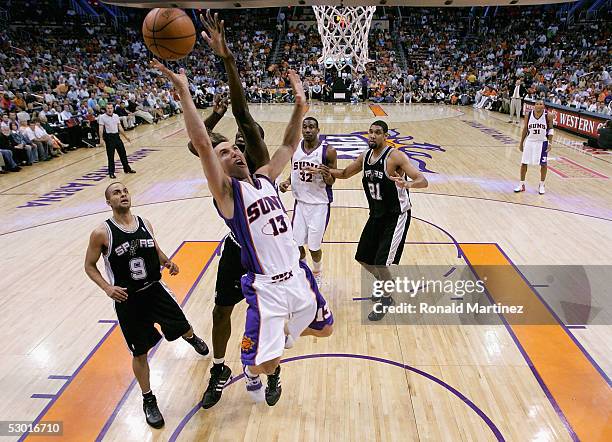 Steve Nash of the Phoenix Suns loses the ball under pressure from Nazr Mohammed of the San Antonio Spurs in Game two of the Western Conference Finals...