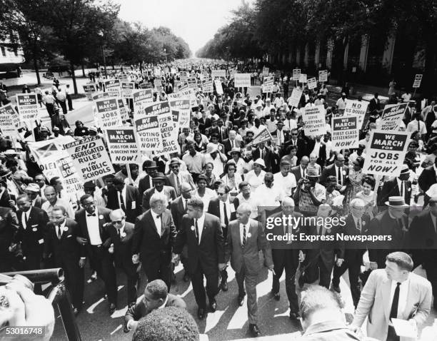 Civil rights Leaders hold hands as they lead a crowd of hundreds of thousands at the March on Washington for Jobs and Freedom, Washington DC, August...