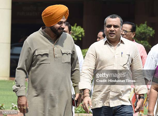 MPs Navjot Singh Sidhu and Paresh Rawal after the BJP Parliamentary Party meeting at Parliament House, on May 10, 2016 in New Delhi, India. The Lok...