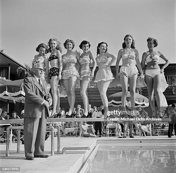 Film Director Mack Sennett poses with his Sennett Bathing Beauties in Los Angeles,CA.
