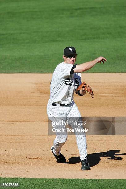Joe Crede, #24 of the Chicago White Sox fields the ball at third base and throws to first during the game against the Los Angeles Angels at U.S....
