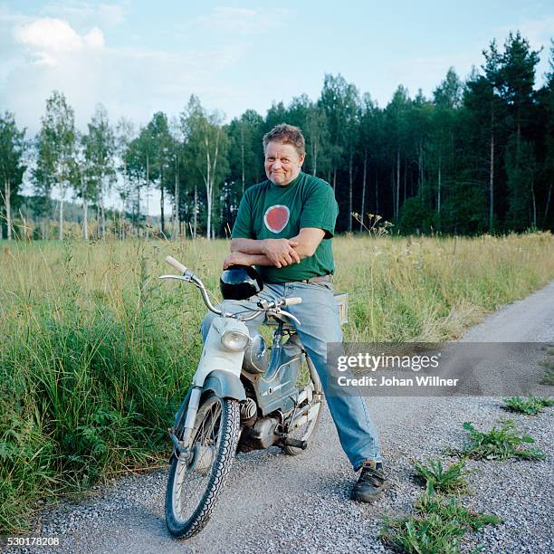 mature man on old motorcycle - moped stock-fotos und bilder