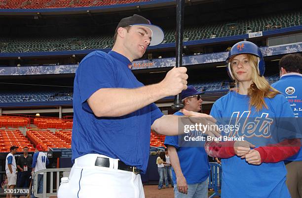 Third baseman David Wright of the New York Mets gives actress Claire Danes a few tips during batting practice for Project A.L.S. At Shea Stadium on...