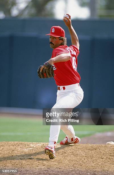 Dennis Eckersley of the St. Louis Cardinals winds back to pitch the ball during a game. Dennis Eckersley played for the St. Louis Cardinals from...