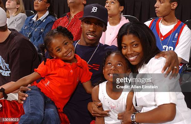 Chauncey Billups and his wife Piper with their kids watch the Detroit Shock play the New York Liberty during their game at the Palace of Auburn...