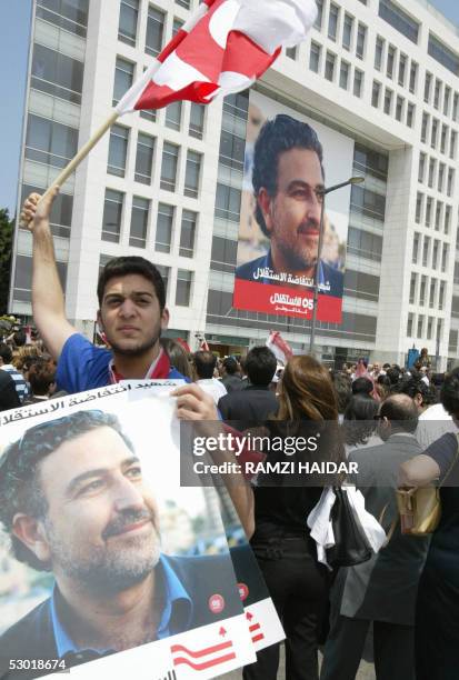 Lebanese mourners gather in front of the headquarters of An-Nahar daily during the funeral of murdered columnist Samir Kassir who regularly wrote...