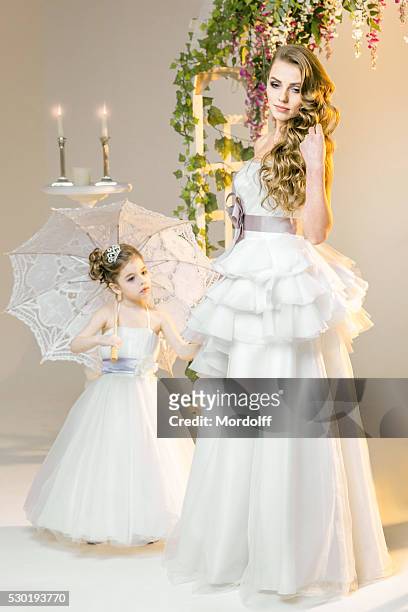 bride and her little bridesmaid - bridesmaid stock pictures, royalty-free photos & images