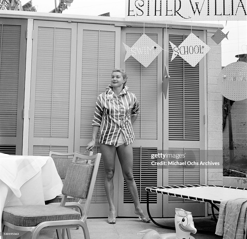 Esther Ravier Actress Esther Williams poses by her Esther Williams Swim School sign ...