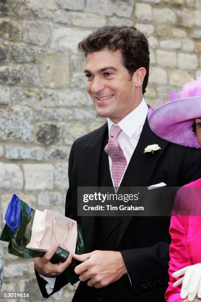 Brother of the groom, Edward van Cutsem, is seen among guests at the society wedding of Hugh Van Cutsem Junior to Rose Astor at Burford Parish Church...