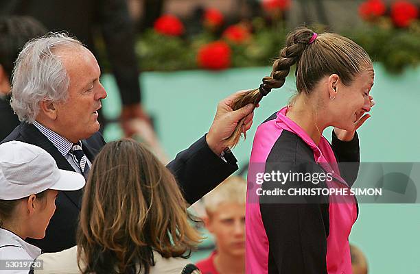 Christian Bimes, president of the Tennis French Federation conforts French Mary Pierce after her women's final match of the tennis French Open at...