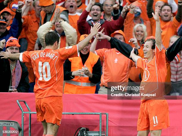 Arjen Robben of the Netherlands celebrates his goal with Rafael van der Vart during the World Cup qualification match between Netherlands and Romania...