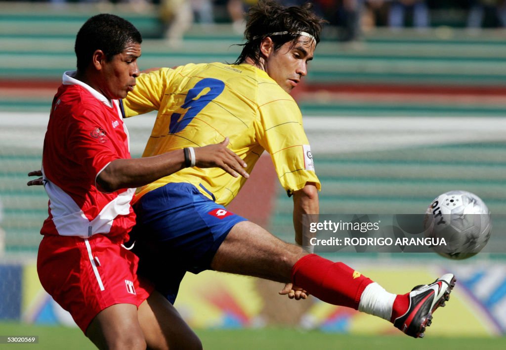 Wilmer Acasiete of Peru vies for the bal